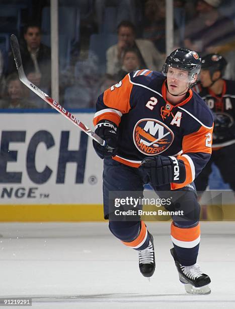 Mark Streit of the New York Islanders skates against the New Jersey Devils during preseason action at the Nassau Veterans Memorial Coliseum on...