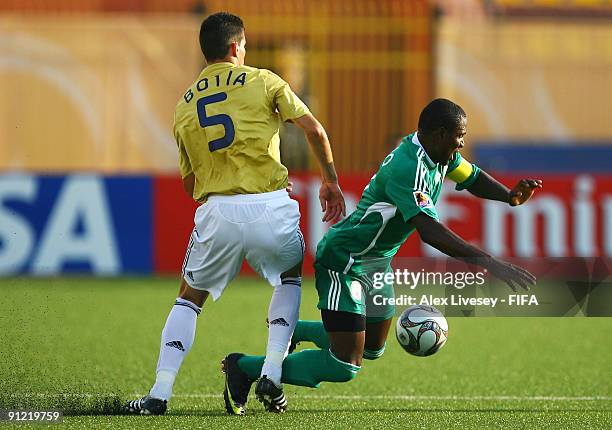 Odion Ighalo of Nigeria is tackled by Alberto Botia of Spain during the FIFA U20 World Cup Group B match between Nigeria and Spain at the Al Salam...