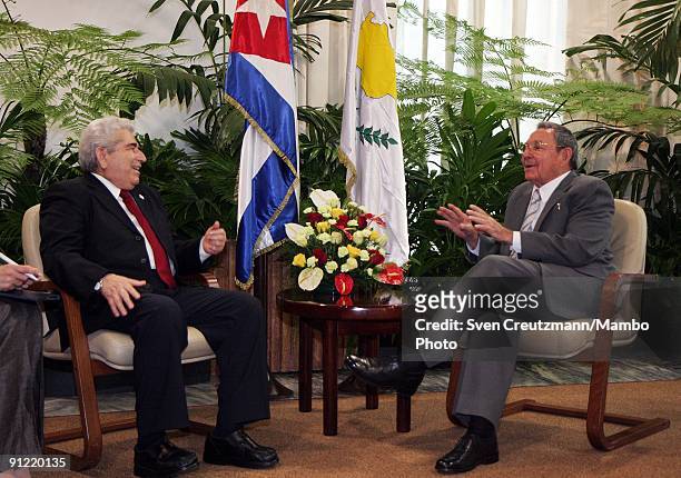 Raul Castro , President of Cuba and brother of Fidel Castro, talks to Demetris Christofias President of Cyprus, after the official welcome ceremony...