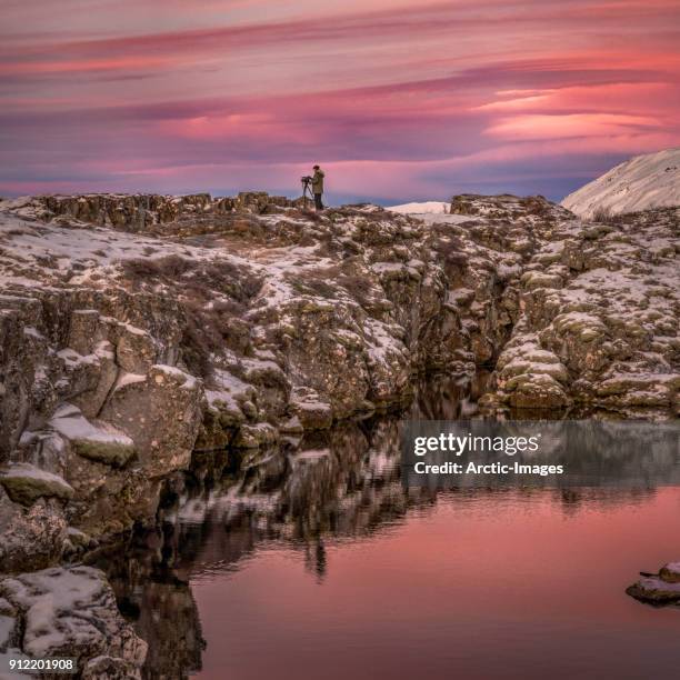 videographer working at sunset, iceland - film crew stock pictures, royalty-free photos & images