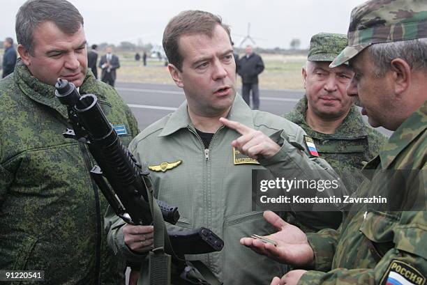 Russian Defence Minister Anatoly Serdyukov and Chief of the General Staff of the Armed Forces Nikolai Makarov look on as President Dmitry Medvedev...