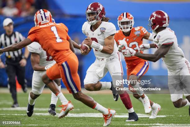 Alabama Crimson Tide quarterback Jalen Hurts runs with the football during the College Football Playoff Semifinal at the Allstate Sugar Bowl between...