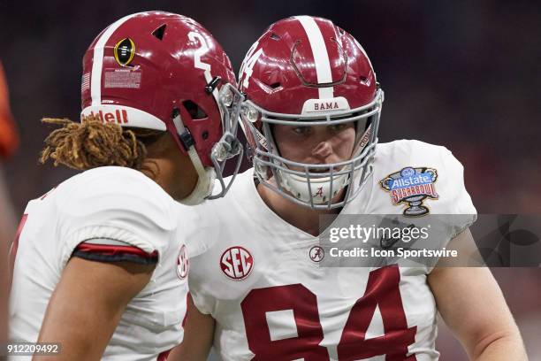 Alabama Crimson Tide tight end Hale Hentges listens to Alabama Crimson Tide quarterback Jalen Hurts during the College Football Playoff Semifinal at...