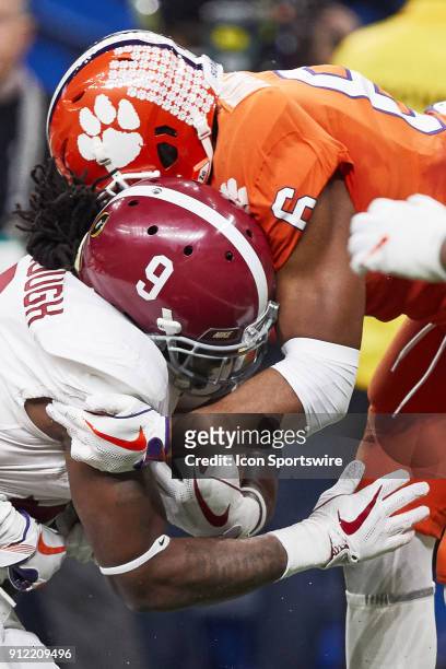 Alabama Crimson Tide running back Bo Scarbrough battles with Clemson Tigers linebacker Dorian O'Daniel during the College Football Playoff Semifinal...
