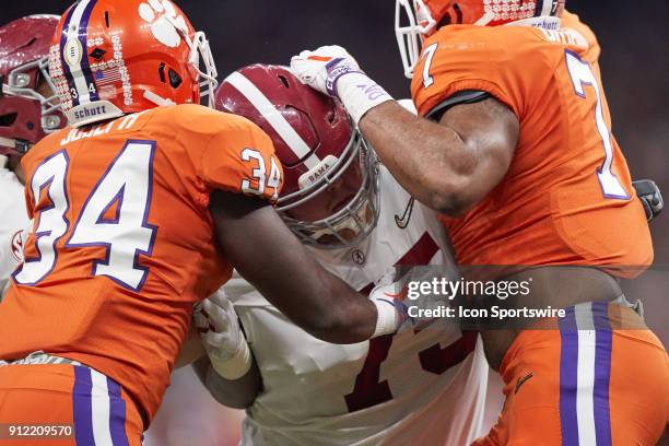 Alabama Crimson Tide offensive lineman Bradley Bozeman battles with Clemson Tigers defensive end Austin Bryant and Clemson Tigers linebacker Kendall...