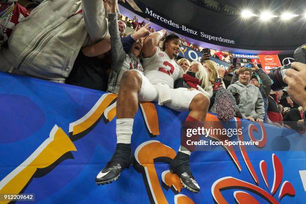 Alabama Crimson Tide quarterback Jalen Hurts celebrates with fans after the College Football Playoff Semifinal at the Allstate Sugar Bowl between the...