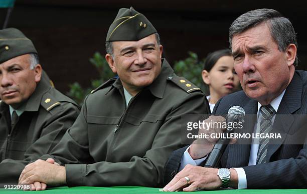 Director of the Office of National Drug Control Policy Gil Kerlikowske , sitting beside Colombian National Police Director, Oscar Naranjo, delivers a...