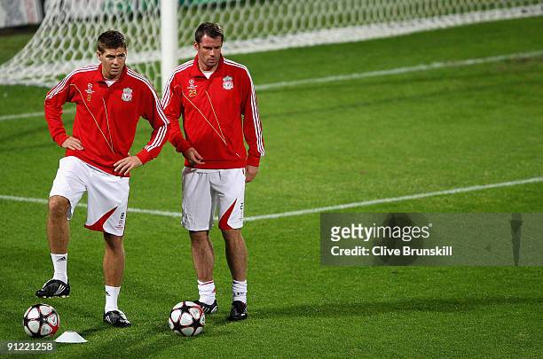 Steven Gerrard and Jamie Carragher of Liverpool during a training session prior to the UEFA Champions League Group E match between Fiorentina and...