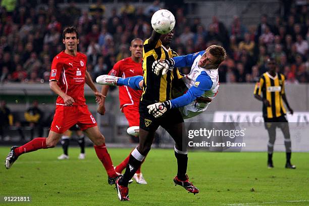 Herve Oussale of Aachen challenges goalkeeper Michael Ratajczak of Duesseldorf during the 2nd Bundesliga match between Fortuna Duesseldorf and...