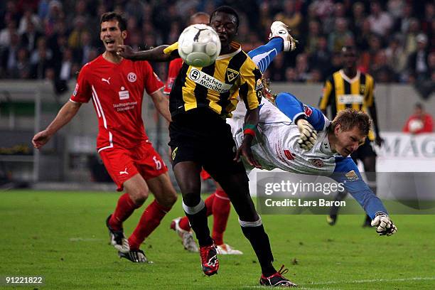 Herve Oussale of Aachen challenges goalkeeper Michael Ratajczak of Duesseldorf during the 2nd Bundesliga match between Fortuna Duesseldorf and...