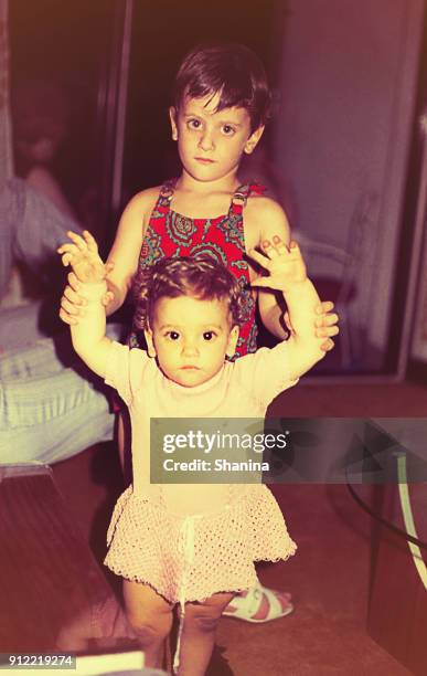 boy and girl brothers at home - vintage photograph stock pictures, royalty-free photos & images