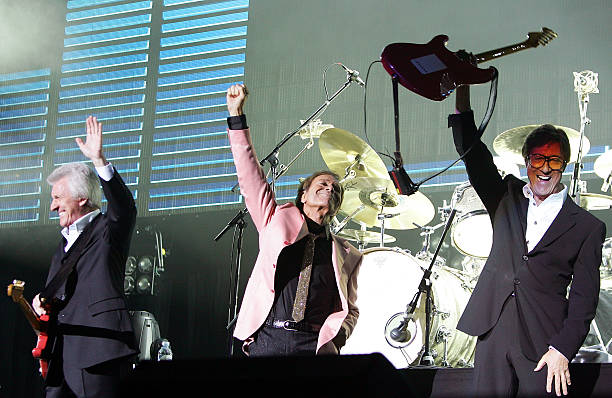 Bruce Welch, Sir Cliff Richard and Hank Marvin of The Shadows performs live on stage at the O2 Arena on September 28, 2009 in London, England.