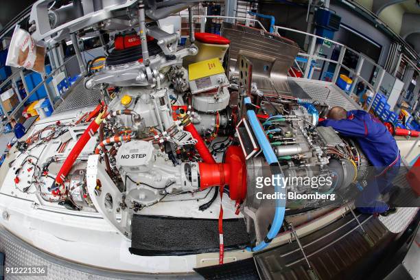 An employee works on AgustaWestland AW189 helicopter at a Leonardo SpA plant in Vergiate, Italy, on Tuesday, Jan. 30, 2018. Leonardo said it will...