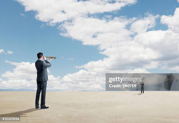 two people looking at each other through spyglasses - day telescope stock pictures, royalty-free photos & images