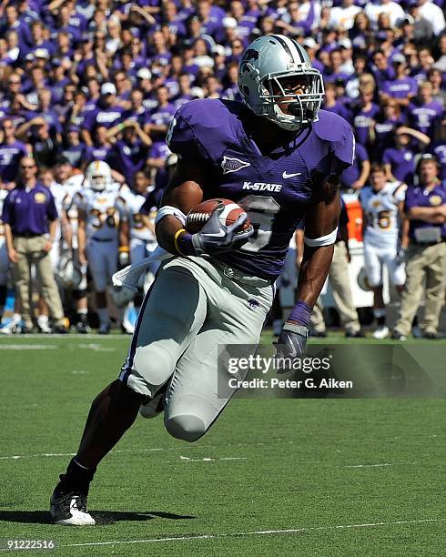 Running back Daniel Thomas of the Kansas State Wildcats rolls to the outside enroute to a first quarter touchdown against the Tennessee Tech Golden...