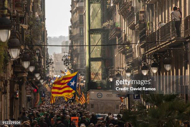 Demonstrators take part in a protest to support former Catalan President, Carles Puigdemont on January 30, 2018 in Barcelona, Spain. The President of...