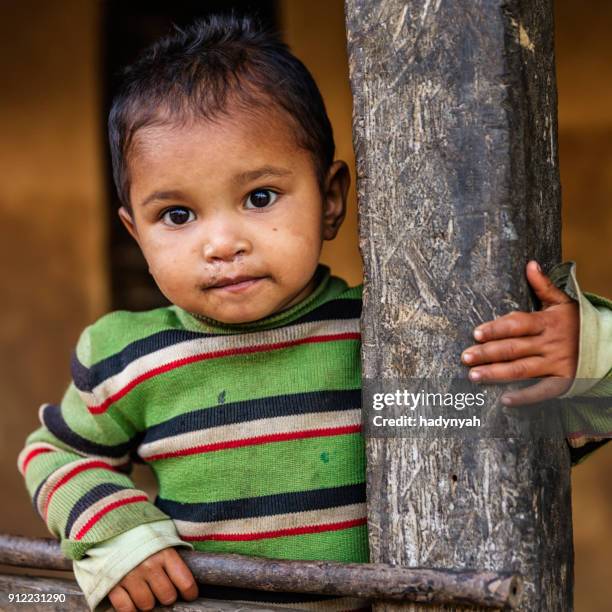 nepalese little girl in village near annapurna range - nepal children stock pictures, royalty-free photos & images
