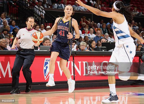 Tully Bevilaqua of the Indiana Fever drives the ball against Lindsey Harding of the Washington Mystics during Game One of the WNBA Eastern Conference...