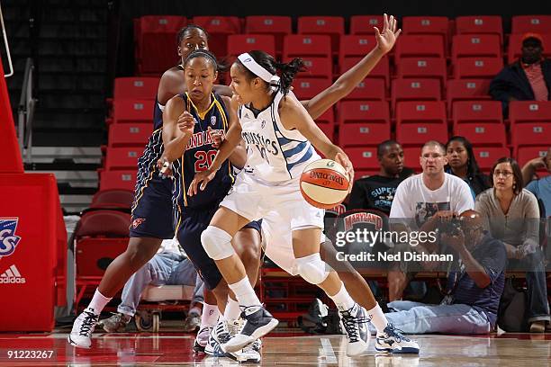 Lindsey Harding of the Washington Mystics drives the ball against Briann January of the Indiana Fever during Game One of the WNBA Eastern Conference...