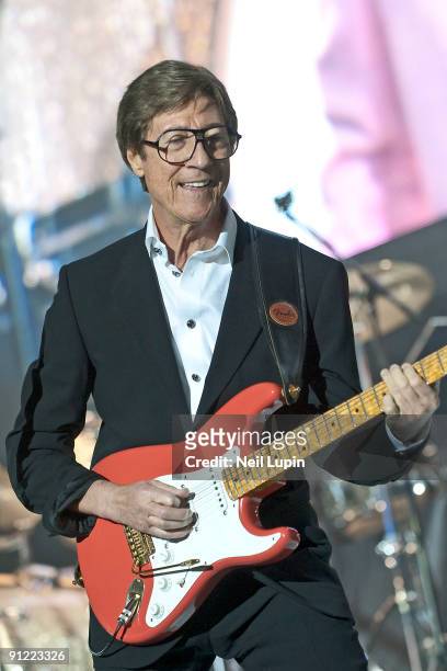 Hank Marvin performs on stage with Cliff Richard and The Shadows at the O2 Arena on September 28, 2009 in London, England.