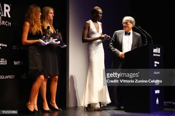 Alek Wek and Giuseppe Zanotti attend the amfAR Milano 2009 Auction And Show, the Inaugural Milan Fashion Week event at La Permanente on September 28,...
