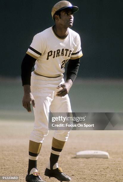 S: Outfielder Roberto Clemente Pittsburgh Pirates leads off of second base during a MLB baseball game circa early 1970's at Three Riverfront Stadium...