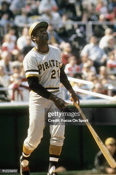 Outfielder Roberto Clemente Pittsburgh Pirates swings and watches the flight of his ball during a MLB baseball game circa early 1970's. Clemente'...