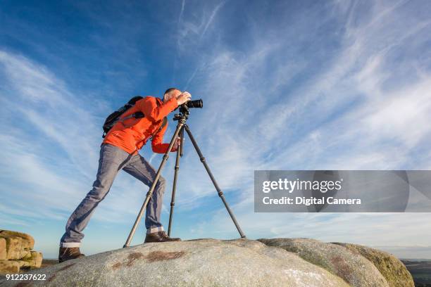 Digital Camera editor Ben Brain taking pictures at Stanage Edge in Derbyshire, on September 8, 2017.