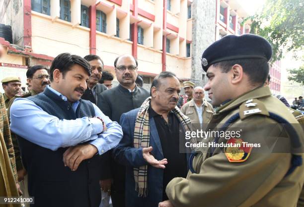 Senior BJP leader Manoj Tiwari along with other leaders, interact with police officers, outside the Civil Lines police station, after lodging an FIR...