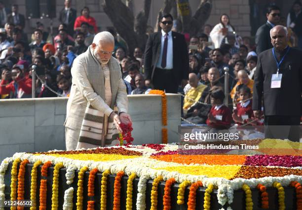Prime Minister Narendra Modi pays homage to Mahatma Gandhi on his 70th death anniversary, also observed as Martyrs' Day, at Rajghat on January 30,...