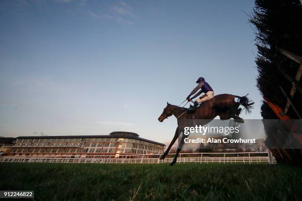 David Crosse riding Stolberg clear the last in fron of the hotel to win The Premier League Betting At 188Bet Handicap Hurdle at Lingfield Park...