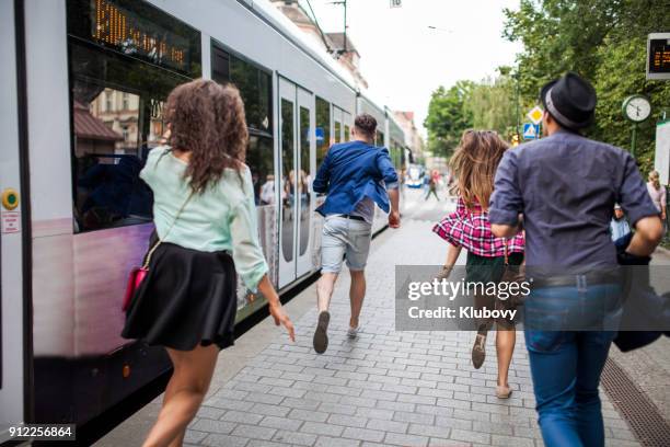 group of young people on a bus/tram stop - poland people stock pictures, royalty-free photos & images