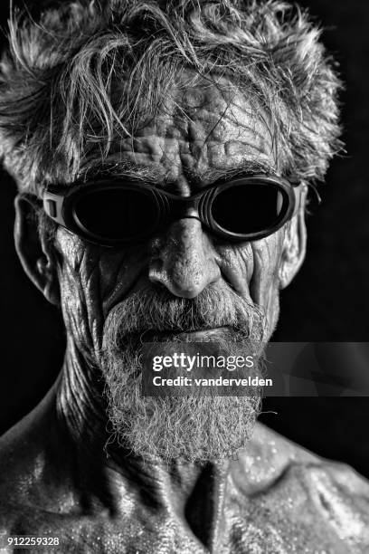 grey-haired man wearing swimming goggles - vandervelden stock pictures, royalty-free photos & images