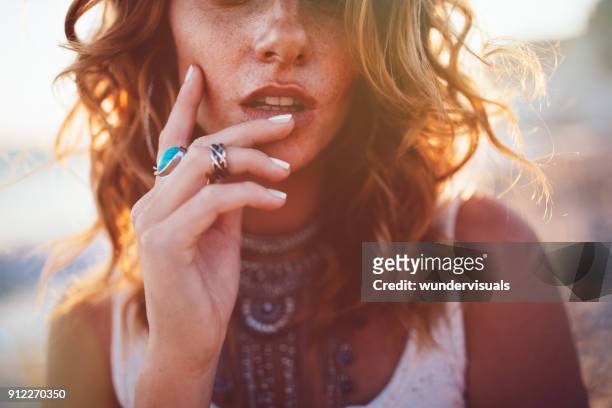 young woman wearing bohemian style silver jewelry - wavy hair stock pictures, royalty-free photos & images
