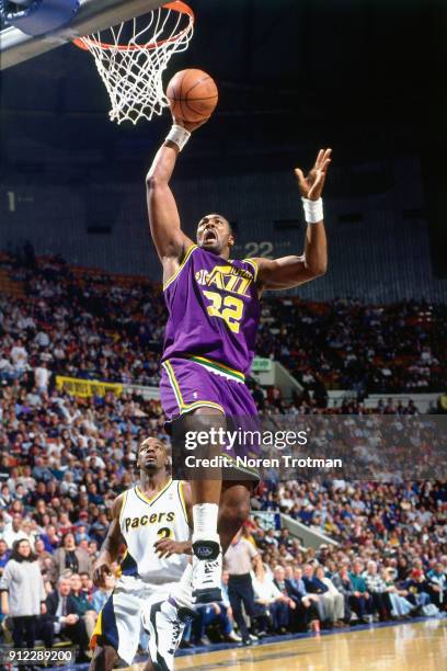Karl Malone of the Utah Jazz dunks during a game played on January 16, 1995 at Market Square Arena in Indianapolis, Indiana. NOTE TO USER: User...