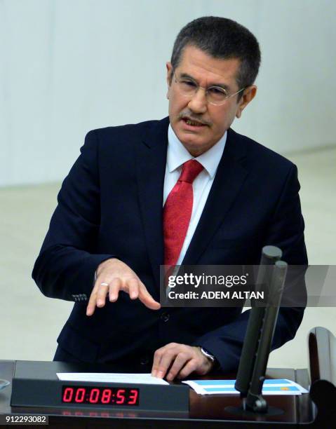 Turkish Defense Minister Nurettin Canikli speaks in parliament in Ankara on January 30 concerning ongoing Turkish operations in the Afrin region....