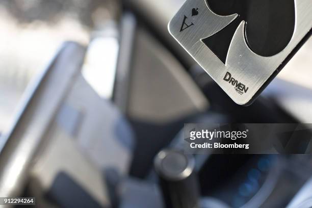An Energizer Holdings Inc. Driven by Refresh Your Car! brand air freshener hangs from a rearview mirror in Tiskilwa, Illinois, U.S., on Tuesday, Jan....