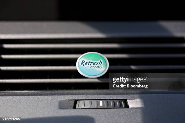 An Energizer Holdings Inc. Refresh Your Car! brand air freshener sits in a vehicle air vent in Tiskilwa, Illinois, U.S., on Tuesday, Jan. 30, 2018....