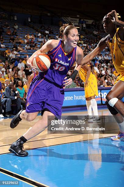 Nicole Ohlde of the Phoenix Mercury drives to the basket against Lisa Leslie of the Los Angeles Sparks in Game One of the Western Conference Finals...