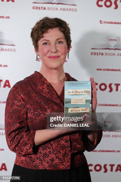 British author Rebecca Stott poses with her 'Biography' Award winning book 'In the Days of Rain' as she arrives for the 2017 Costa Book Awards in...