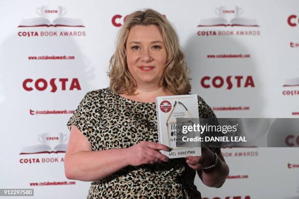 British author Gail Honeyman poses with her 'First Novel' Award winning book 'Eleanor Oliphant is Completely Fine' as she arrives for the 2017 Costa...