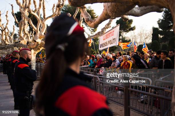 Demonstrators take part in a protest to support former Catalan President, Carles Puigdemont in front of the Parliament of Catalonia on January 30,...
