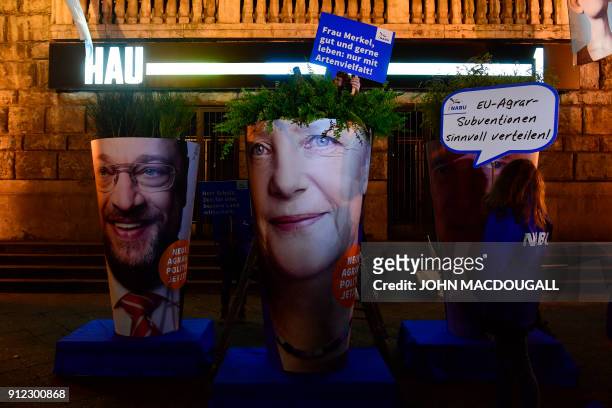 Activists of the Naturbundschutz arrange giant portraits of leader of the Social Democratic Party Martin Schulz, German Chancellor and leader of the...