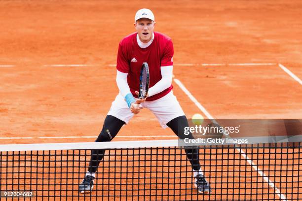 Dominic Inglot of Great Britain practices ahead of the Davis Cup by BNP Paribas World Group First Round match between Spain and Great Britain on...