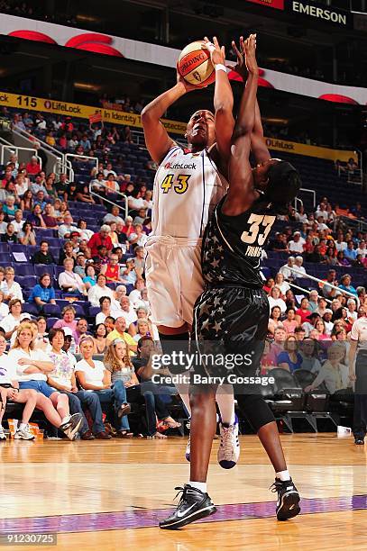 Le'coe Willingham of the Phoenix Mercury takes the ball to the basket against Sophia Young of the San Antonio Silver Stars in Game Two of the WNBA...