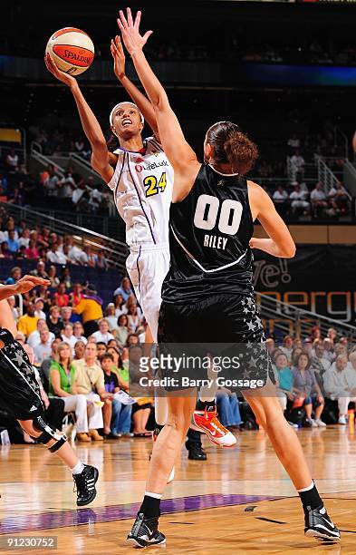 DeWanna Bonner of the Phoenix Mercury takes the ball to the basket against Ruth Riley of the San Antonio Silver Stars in Game Two of the WNBA Western...