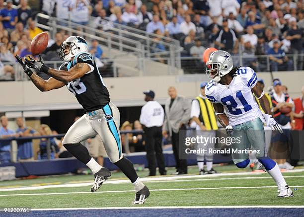 Dante Rosario of the Carolina Panthers catches a touchdown pass over Mike Jenkins of the Dallas Cowboys at Cowboys Stadium on September 28, 2009 in...