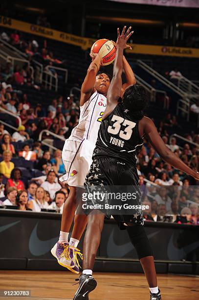 Cappie Pondexter of the Phoenix Mercury takes a jump shot against Sophia Young of the San Antonio Silver Stars in Game Two of the WNBA Western...