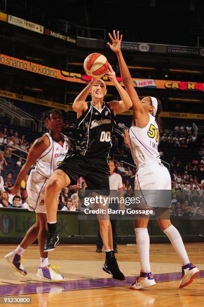 Ruth Riley of the San Antonio Silver Stars shoots against Tangela Smith of the Phoenix Mercury in Game Two of the WNBA Western Conference Semifinals...