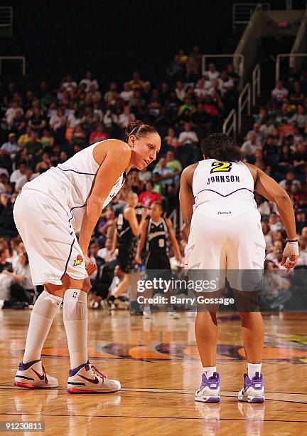 Diana Taurasi and Temeka Johnson of the Phoenix Mercury talk on the court in Game Two of the WNBA Western Conference Semifinals against the San...